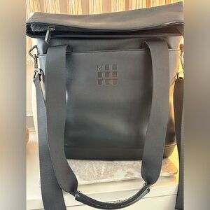 Moleskin messenger tote bag.
Inside / outside pockets.